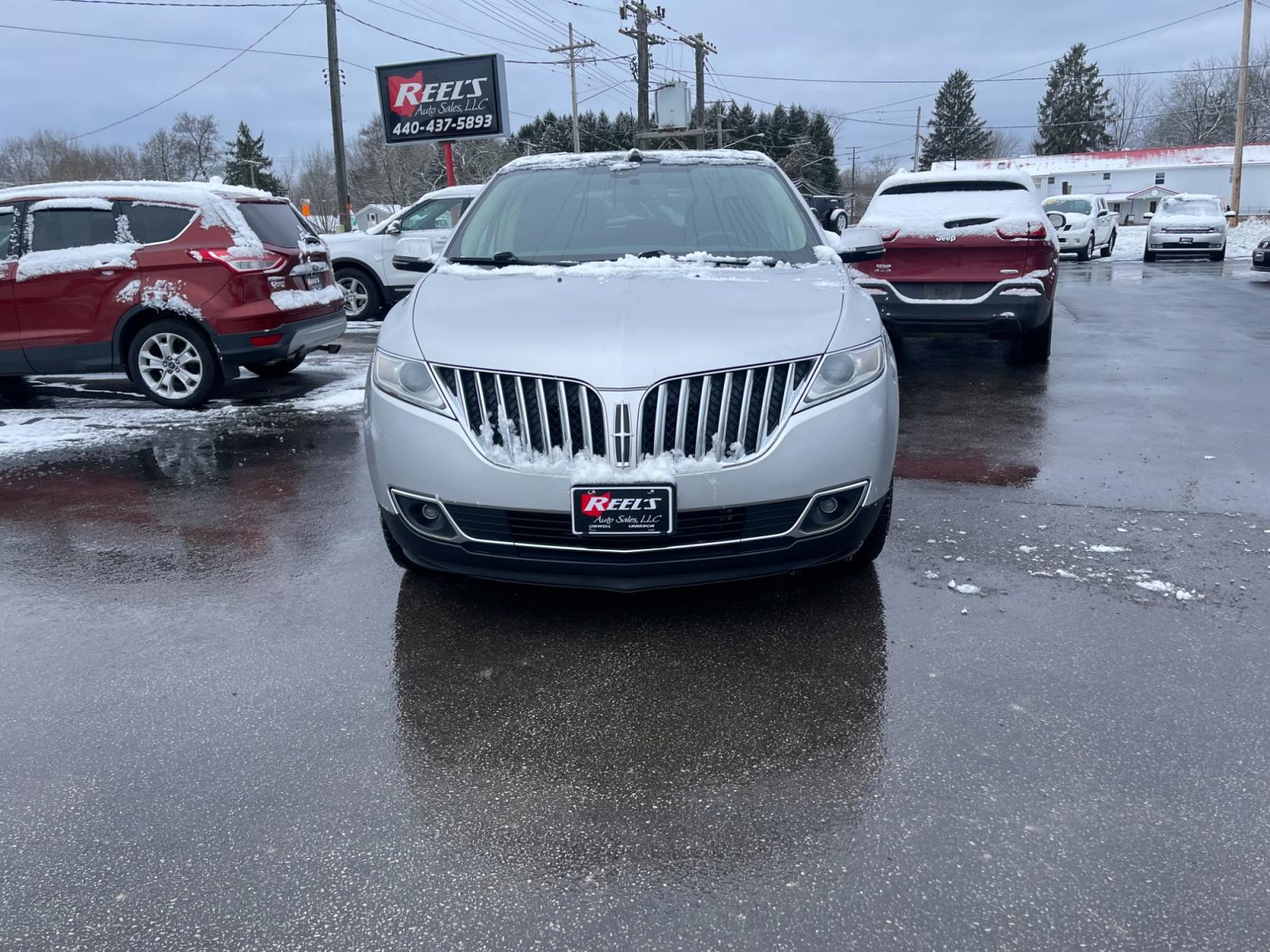 2014 Silver /Black Lincoln MKX Elite AWD (2LMDJ8JK4EB) with an 3.7L V6 DOHC 24V engine, 6-Speed Automatic transmission, located at 547 E. Main St., Orwell, OH, 44076, (440) 437-5893, 41.535435, -80.847855 - This 2014 Lincoln MKX AWD with the Elite Package offers a luxurious and well-appointed driving experience. Under the hood lies a robust 3.7-liter V6 engine mated to a smooth 6-speed transmission, delivering a balance of power and efficiency. Audiophiles will appreciate the premium THX audio system, - Photo #1